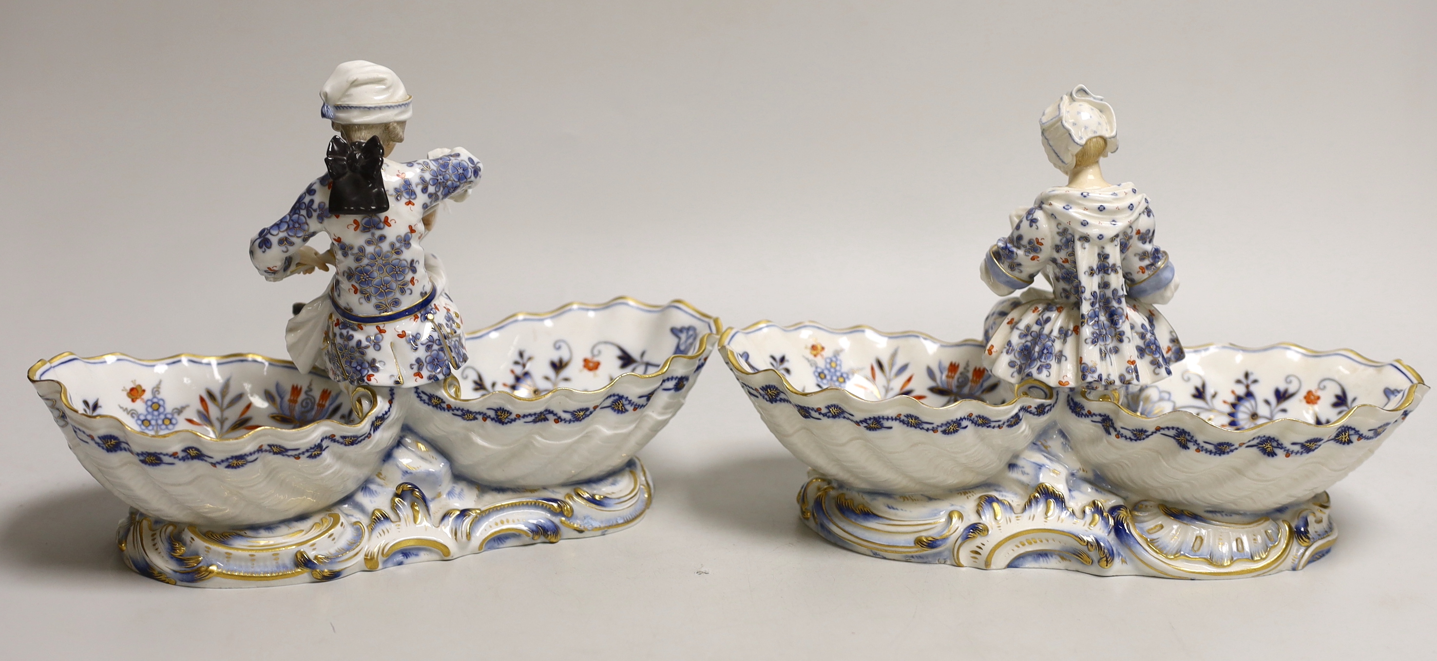 A pair of late 19th century Meissen figural sweetmeat dishes, 24.5cm wide